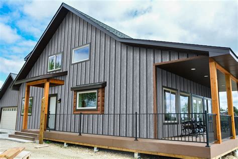 grey house with metal roof|gray siding black windows.